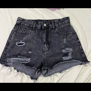 black distressed jean shorts.